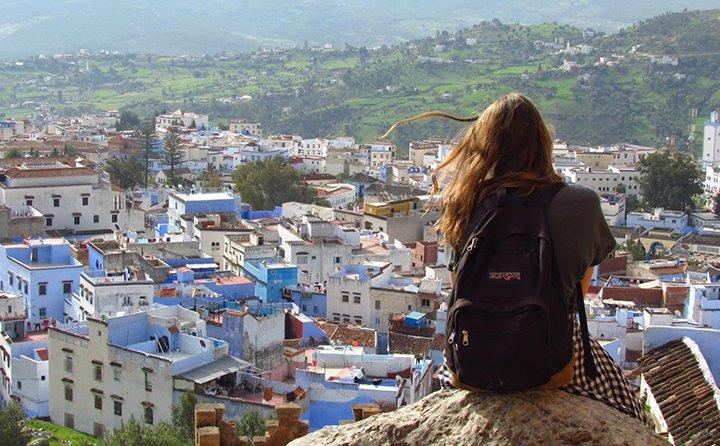 A study abroad student in Morocco, overlooking a town.